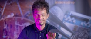 Giordano Scapucci balancing a germanium wafer on his finger