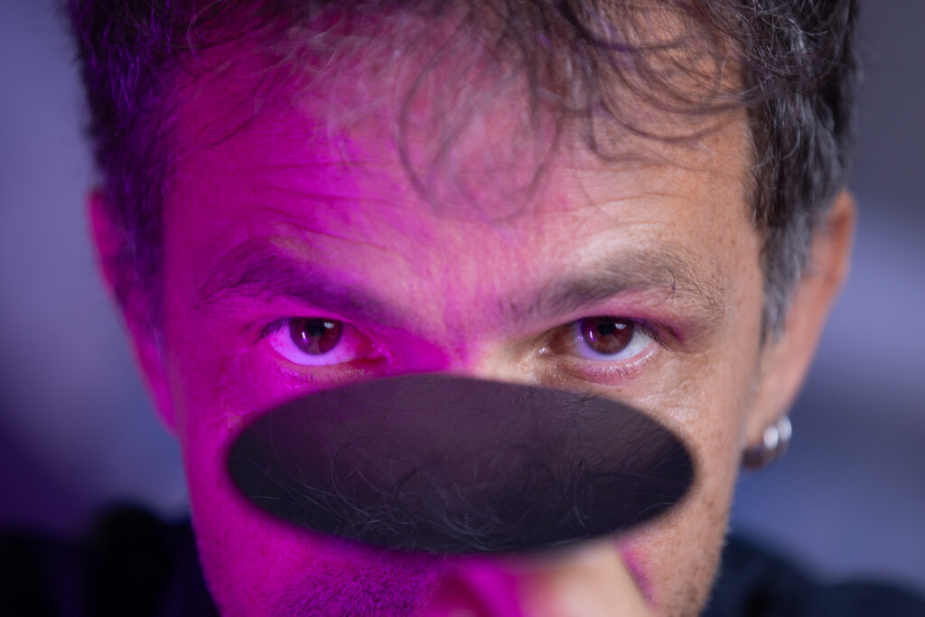 Giordano Scapucci balancing a germanium wafer on his finger
