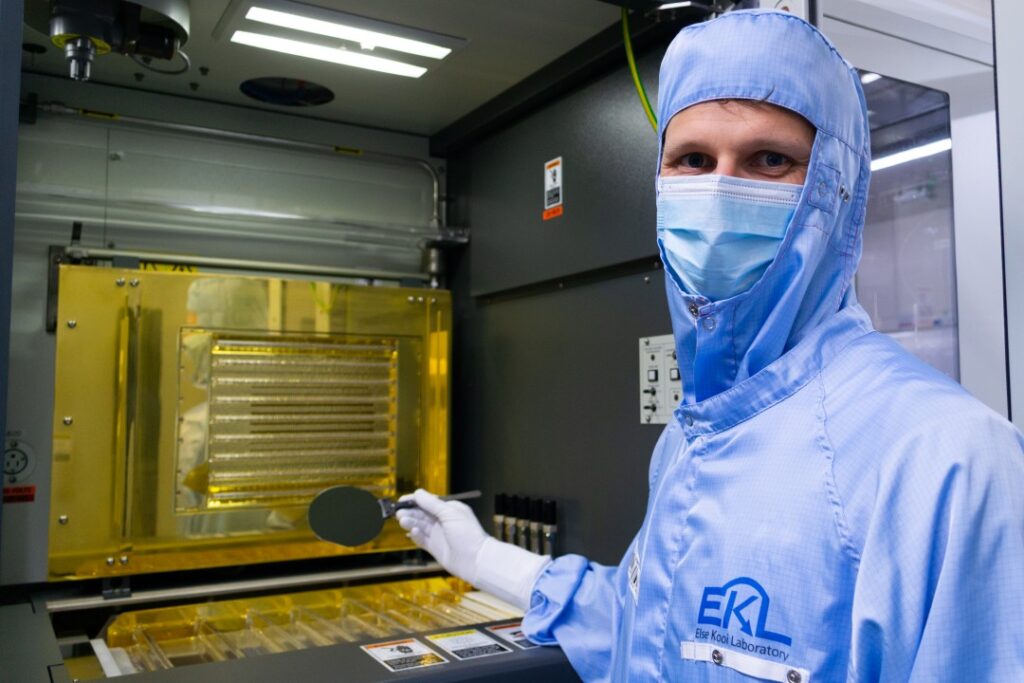 PhD student Lucas Stehouwer with germanium qubit wafer